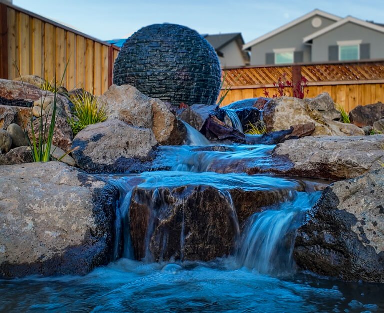 Pondless waterfall with Aquascape sphere in mountain house california